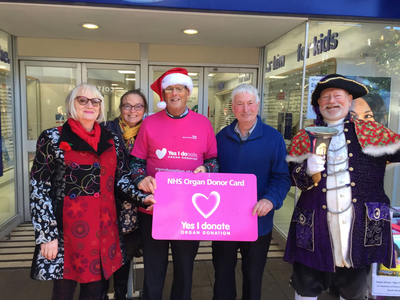 Cllr Steve Gazzard, Eleanor Rylance, Tim Dumper, and the gloriously dressed Exmouth Town Crier.